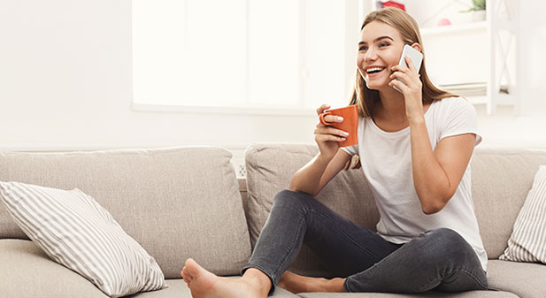 smiling young girl calling on mobile phone